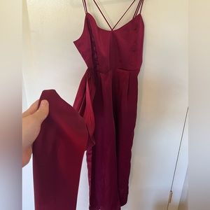 Red jumpsuit with wrap bow
